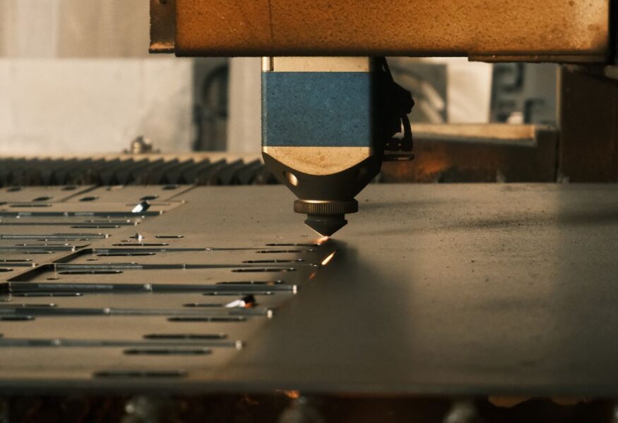 Industrial laser engraving machine cutting metal with sparks - Endless Etchings laser engraving Pompano Beach FL