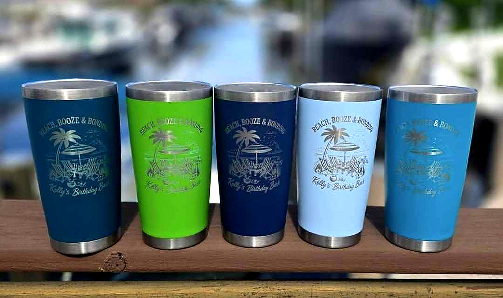 Five colorful Beach, Booze and Bonding custom laser engraved tumblers by Endless Etchings